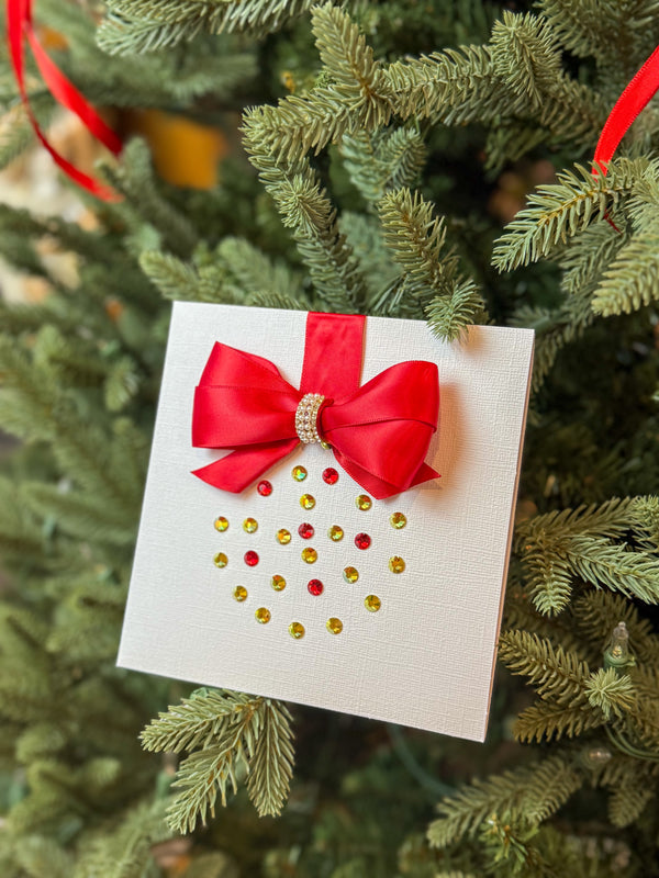 Elegant Handmade Christmas Card with Red Bow and Gem Ornament Design