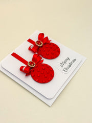 Elegant Handmade Christmas Card with Red Bow and Gem Ornament Design
