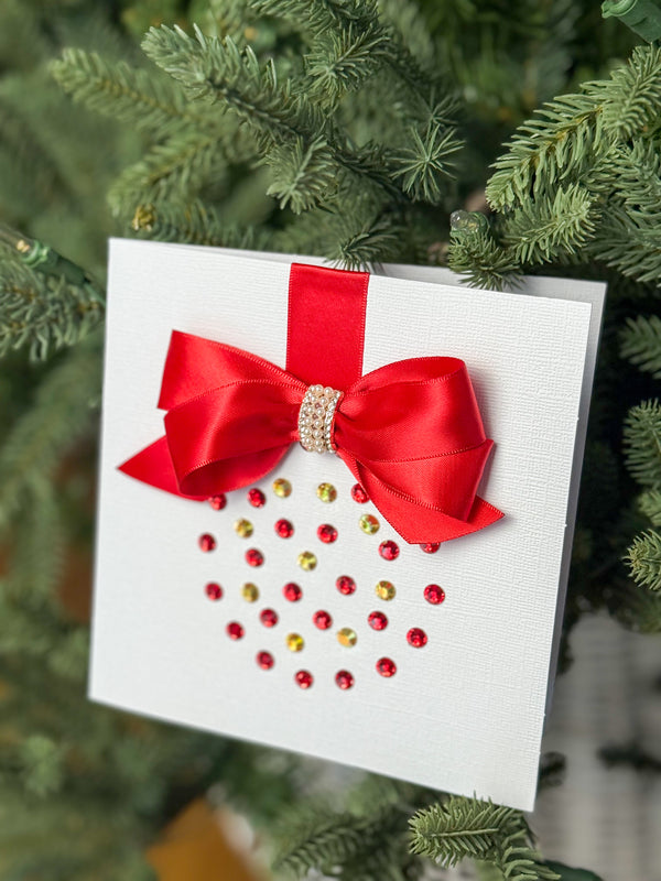 Elegant Handmade Christmas Card with Red Bow and Gem Ornament Design