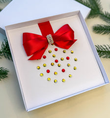 Elegant Handmade Christmas Card with Red Bow and Gem Ornament Design