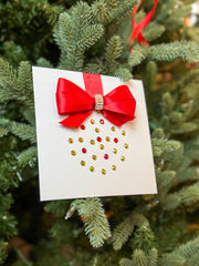Elegant Handmade Christmas Card with Red Bow and Gem Ornament Design