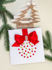 Elegant Handmade Christmas Card with Red Bow and Gem Ornament Design