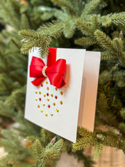 Elegant Handmade Christmas Card with Red Bow and Gem Ornament Design