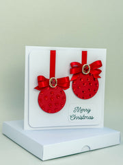 Elegant Handmade Christmas Card with Red Bow and Gem Ornament Design