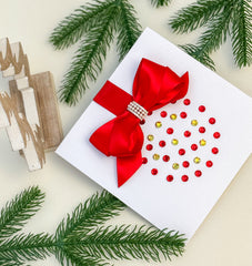 Elegant Handmade Christmas Card with Red Bow and Gem Ornament Design