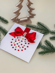 Elegant Handmade Christmas Card with Red Bow and Gem Ornament Design
