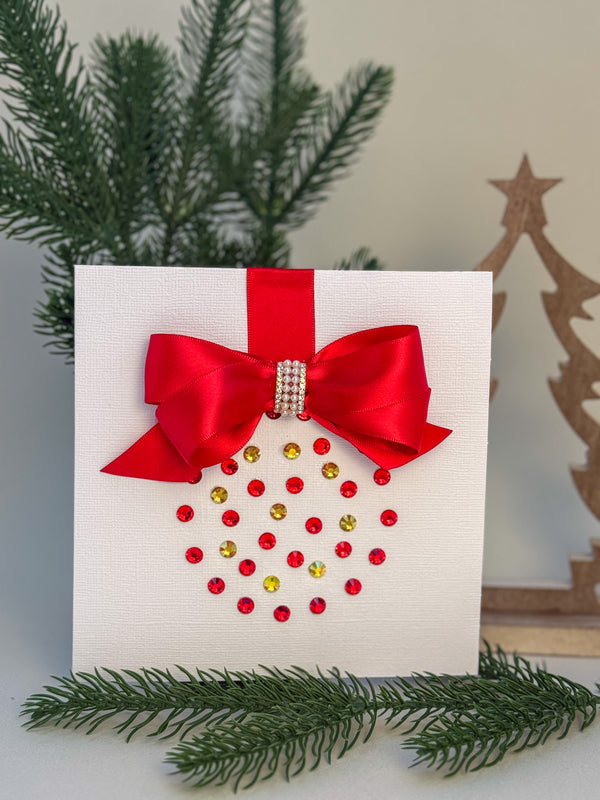 Elegant Handmade Christmas Card with Red Bow and Gem Ornament Design