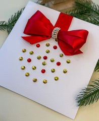 Elegant Handmade Christmas Card with Red Bow and Gem Ornament Design