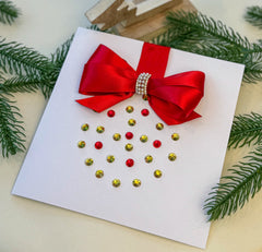 Elegant Handmade Christmas Card with Red Bow and Gem Ornament Design