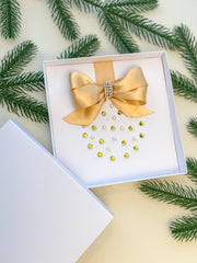 Elegant Handmade Christmas Card with Gold Bow and Gem Ornament Design