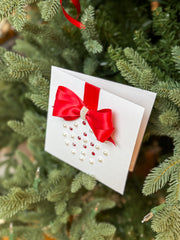 Elegant Handmade Christmas Card with Red Bow and Gem Ornament Design