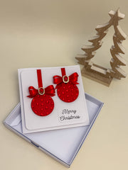 Elegant Handmade Christmas Card with Red Bow and Gem Ornament Design