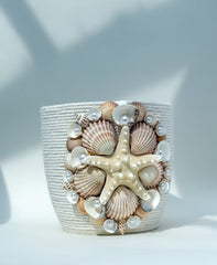 Indoor plant pot with shells