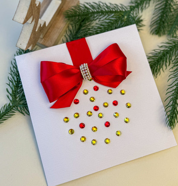 Elegant Handmade Christmas Card with Red Bow and Gem Ornament Design