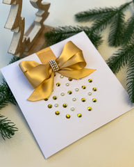 Elegant Handmade Christmas Card with Gold Bow and Gem Ornament Design