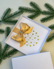 Elegant Handmade Christmas Card with Gold Bow and Gem Ornament Design