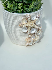 Indoor plant pot with shells