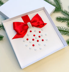 Elegant Handmade Christmas Card with Red Bow and Gem Ornament Design