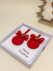 Elegant Handmade Christmas Card with Red Bow and Gem Ornament Design