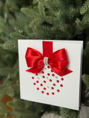 Elegant Handmade Christmas Card with Red Bow and Gem Ornament Design