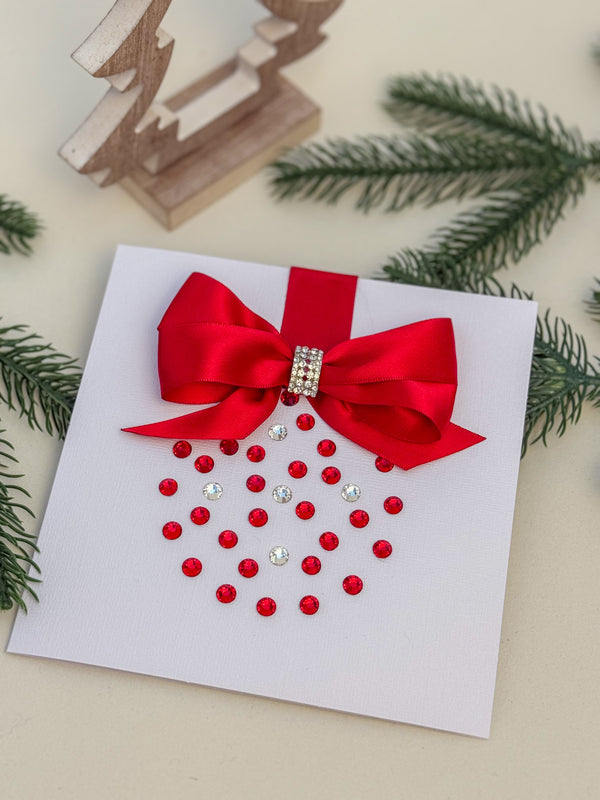 Elegant Handmade Christmas Card with Red Bow and Gem Ornament Design