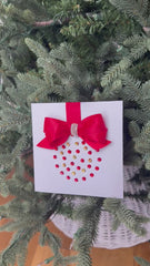 Elegant Handmade Christmas Card with Red Bow and Gem Ornament Design