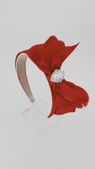 Red headband with bow and feathers