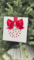 Elegant Handmade Christmas Card with Red Bow and Gem Ornament Design